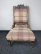 An Edwardian carved oak lady's chair