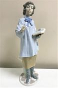 A Lladro figurine : Teacher Woman, model 5048, height 38 cm, unboxed.