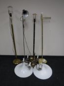 Four continental metal standard and floor lamps together with a brass six way light fitting and a