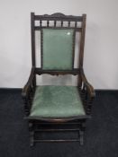 An Edwardian mahogany rocking chair