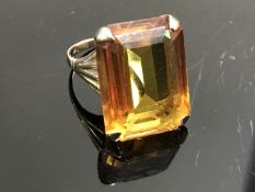 A 9ct gold ring set with a large citrine,
