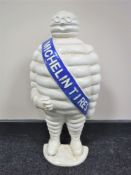 A cast iron half Michelin figure door stop