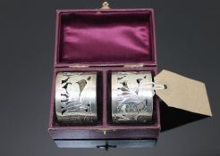 A fine pair of silver napkin rings, cased.