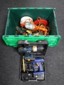 A plastic crate containing hand tools, site light, extension lead,