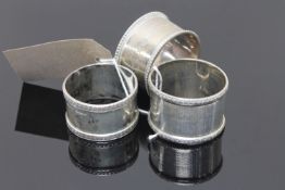 Three heavy gauge silver napkin rings (3)