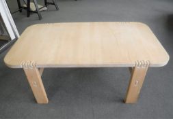 A contemporary beech wood low table
