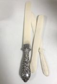 A silver handled ivory letter knife with crest,