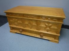 A pine blanket chest fitted with a drawer