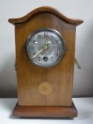 An inlaid mahogany cased Junghans mantel clock with pendulum and key