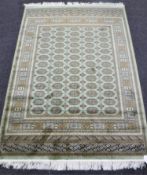 A Bokhara rug 190 cm x 140 cm on green ground