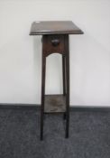 An early 20th century oak plant stand
