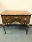 A George III walnut low boy, width 92 cm. CONDITION REPORT: In unrestored condition.