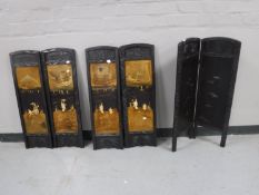 Four Oriental wooden relief panels together with an oriental two fold screen