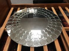 A contemporary circular mirror, diameter 100 cm.