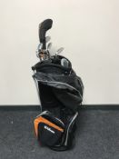 A Wilson golf bag containing part set of Wilson golf clubs