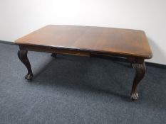 A Victorian mahogany wind out table, with two leaves and winder,