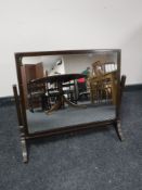 An antique mahogany dressing table mirror
