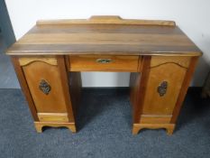A pine and oak twin pedestal desk