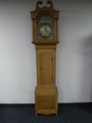 An oak longcase clock with brass dial by signed Stewart,