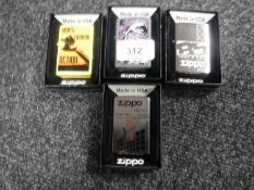 Four boxed Zippo lighters