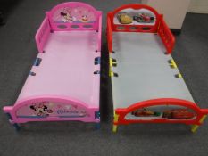 Two plastic children's beds