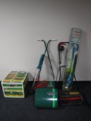 A boxed Qualcast Concorde E30 mower, Black & Decker electric rake, Qualcast 30dl manual mower,