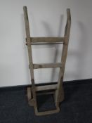 A vintage wooden Slingsby Trucks sack barrow with metal wheels