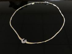 An 18ct white and yellow gold diamond and sapphire set necklace,
