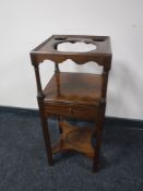 A 19th century mahogany wash stand fitted a drawer