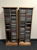 Two pine CD racks containing assorted CDs - jazz etc