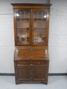 An Edwardian oak bureau bookcase