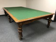 A Victorian oak boardroom table on turned legs fitted two drawers,