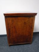 A mid 20th century treadle sewing machine in walnut cabinet (locked)