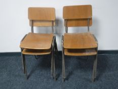 Four metal framed stacking school chairs