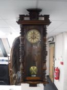 An early 20th century mahogany wall clock