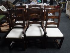 A set of six hardwood ladder back dining chairs
