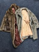 A Canadian fur coat and a simulated fur coat