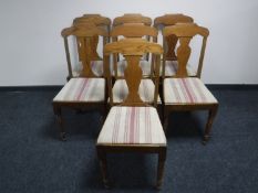 Seven oak dining chairs on turned legs