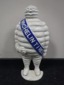 A cast iron half Michelin figure door stop