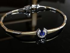 An 18ct white and yellow gold diamond and sapphire set bracelet,
