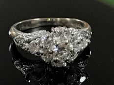 An 18ct gold diamond cluster ring, size I/J.