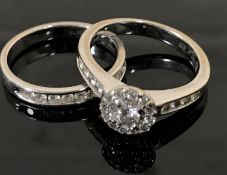 An 18ct white gold diamond cluster ring, set with diamond shoulders, approximately 0.