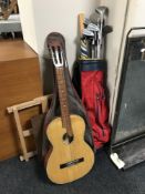 A golf bag containing a set of Dunlop irons and a driver, a dart board,