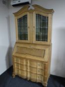 A continental blonde oak bureau bookcase CONDITION REPORT: 200cm high by 105cm wide