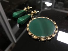 A yellow metal mounted malachite pendant together with matching earrings.