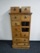 A mango wood ten drawer chest
