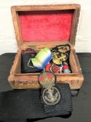 Three WW II star medals on ribbons together with Navy badges and emblem etc.