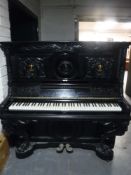A heavily carved, ebonised,