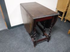 An oak barley twist gate leg table