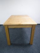 An oak extending dining table